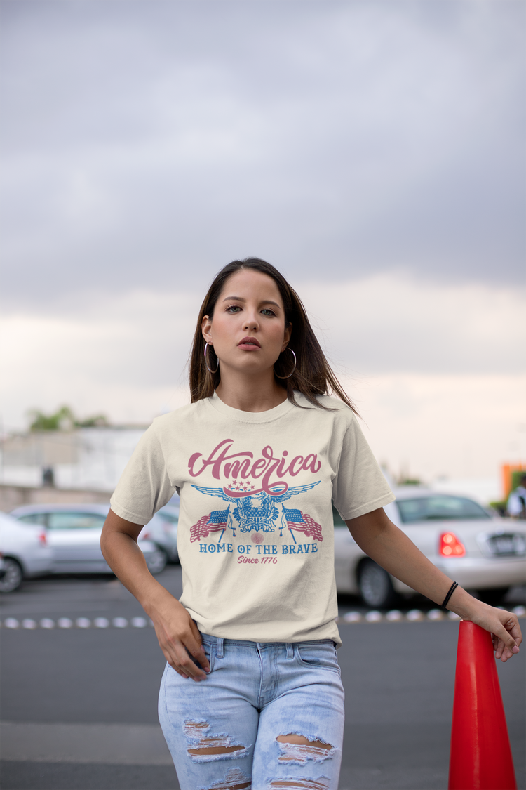Woman wearing a t-shirt with 'America' design in an outdoor setting