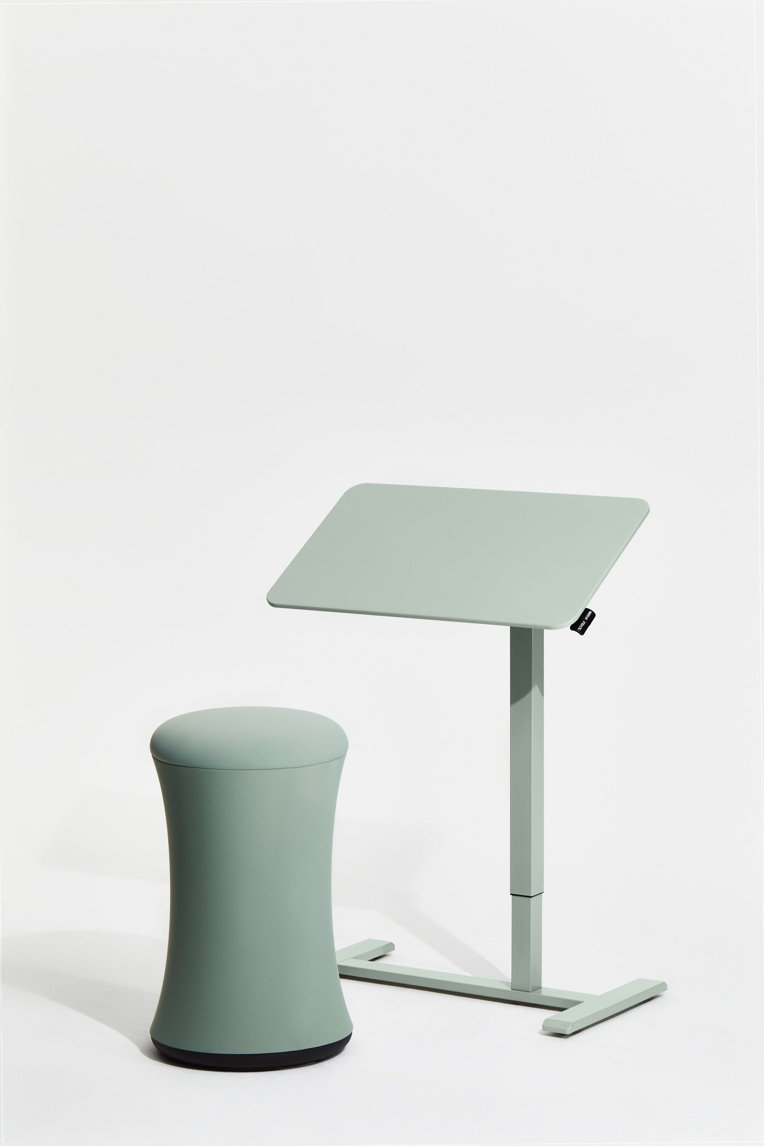 Green adjustable stand with a stool on a white background