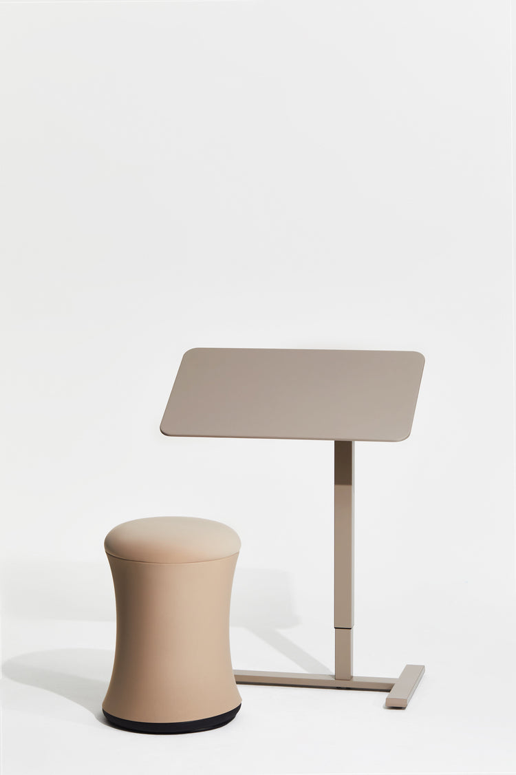 Beige stool and adjustable table on a white background