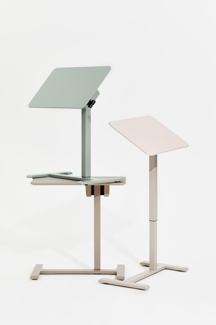 Two adjustable standing desks on a white background