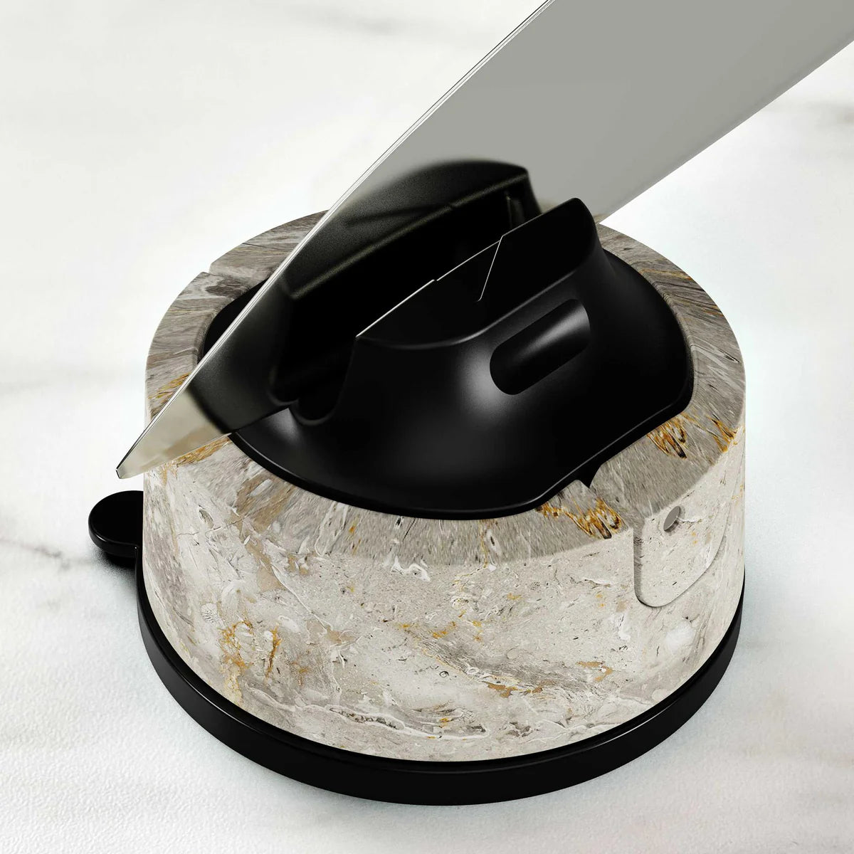 Knife sharpener with a knife on a marble base