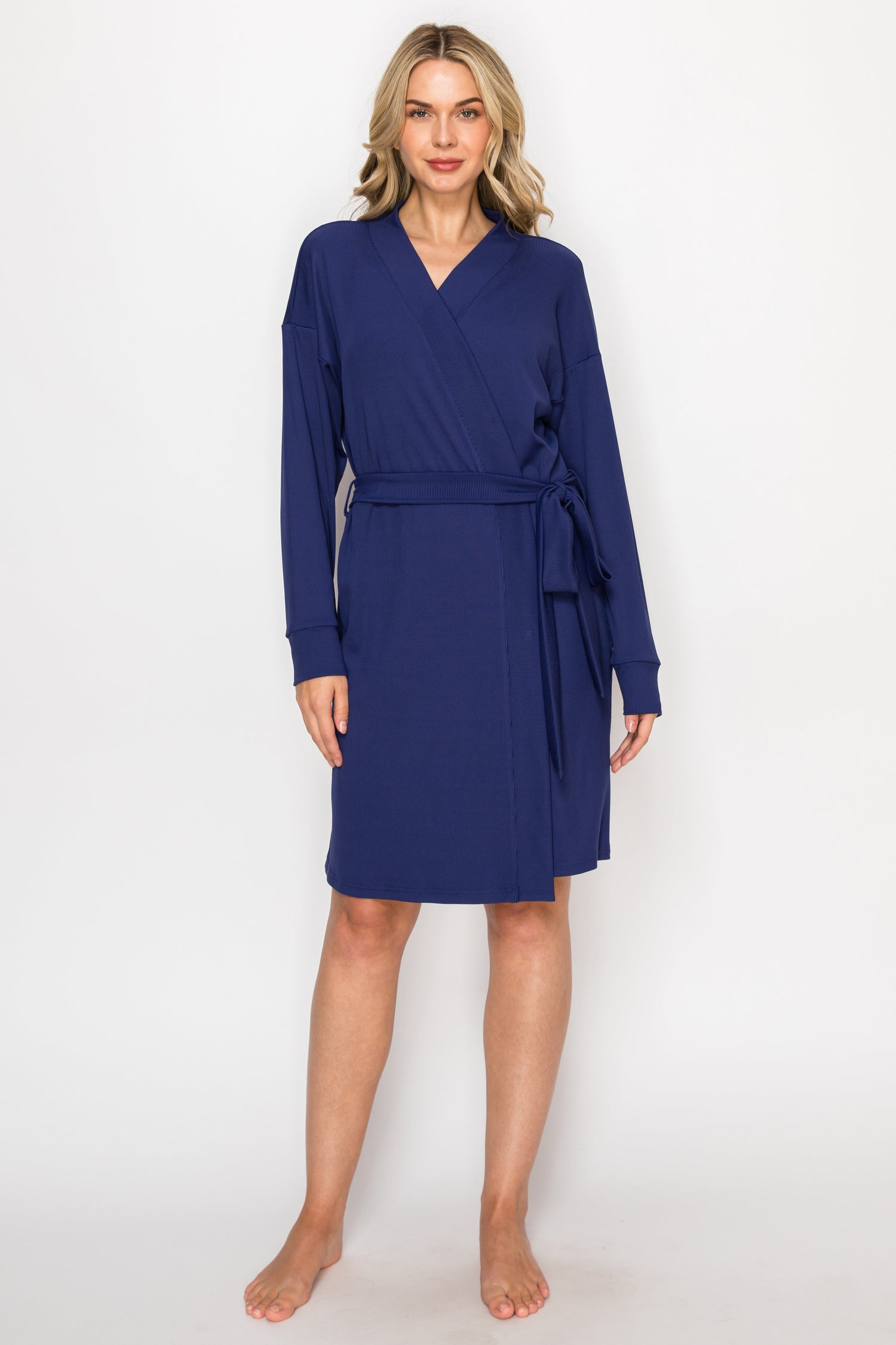 Woman wearing a blue robe on a white background