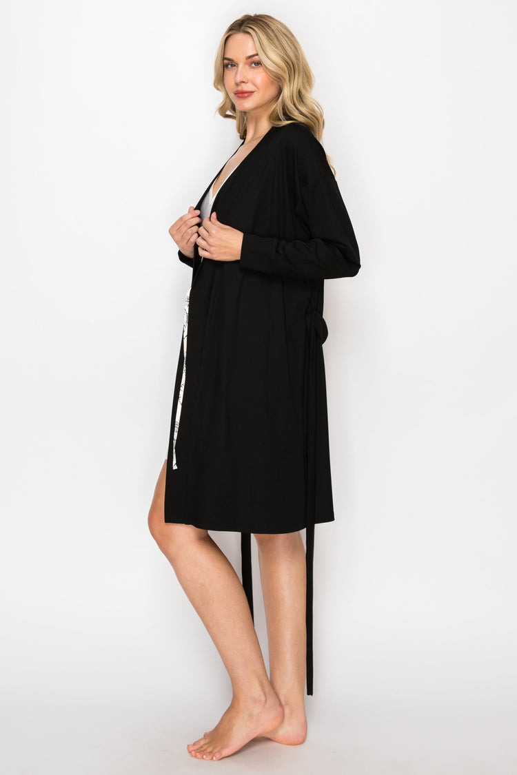 Woman wearing a black robe on a white background