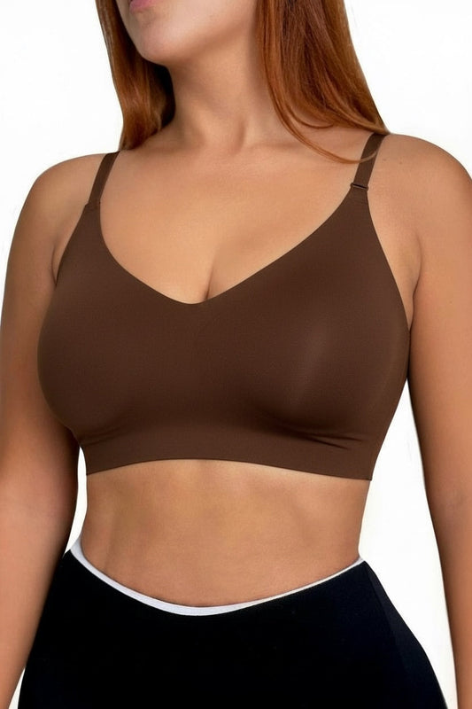 Brown sports bra worn by a person on a white background