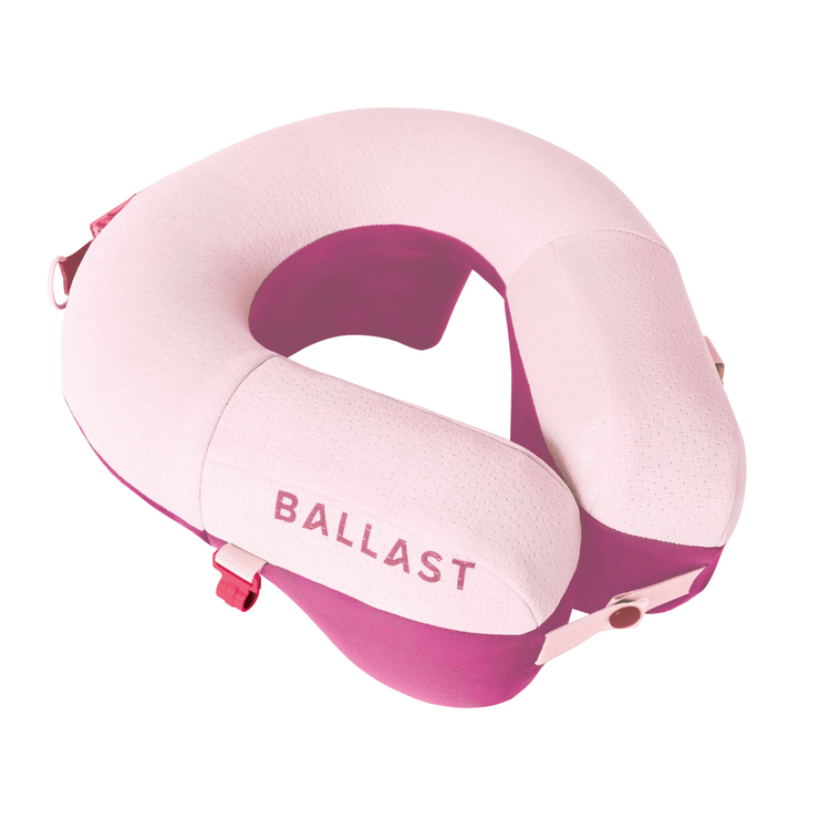 Pink and purple travel neck pillow with 'BALLAST' branding on a white background