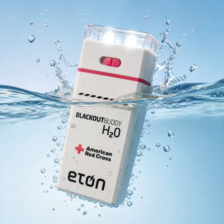 Blackout Buddy H2O device with American Red Cross branding submerged in water.