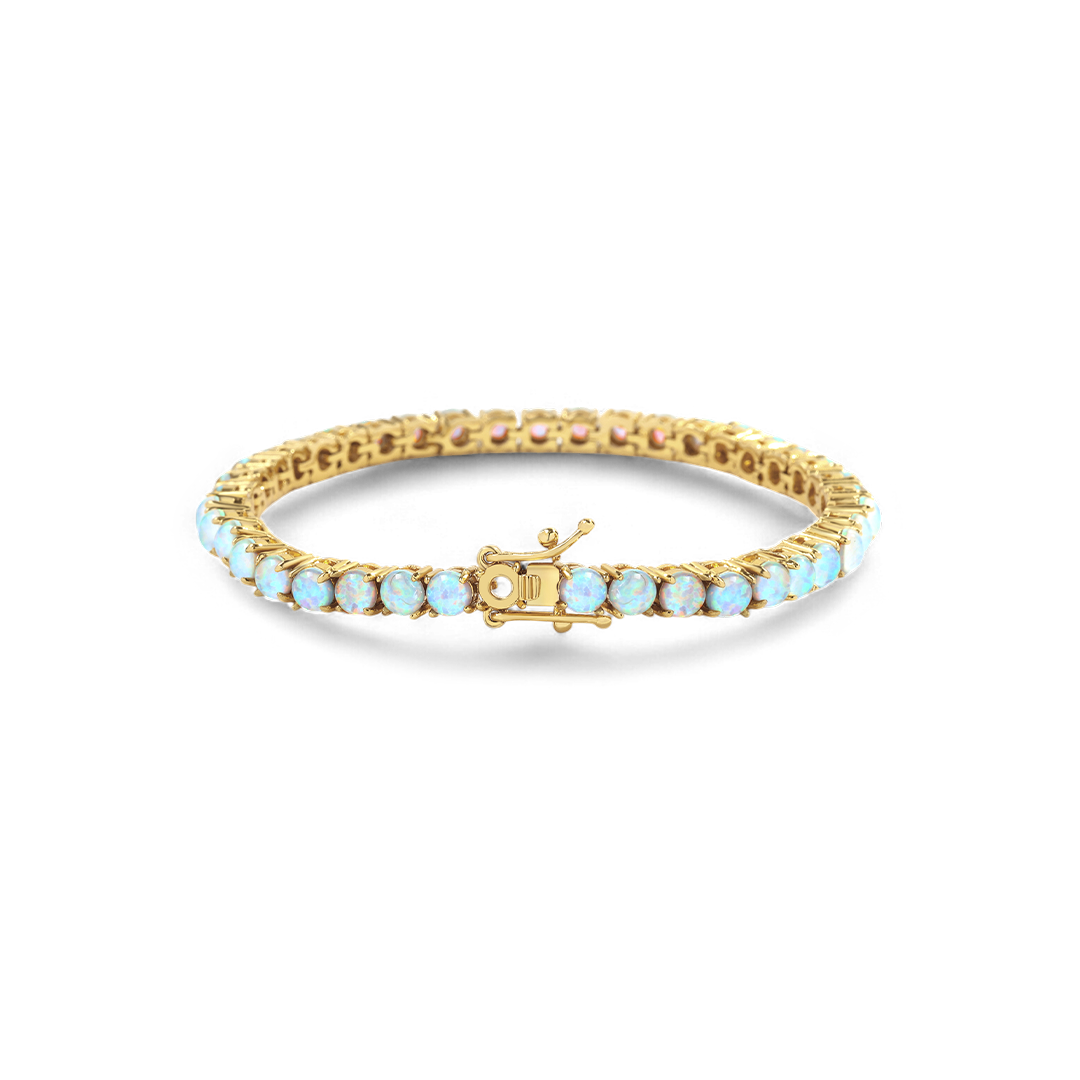 Gold bracelet with light blue stones on a white background