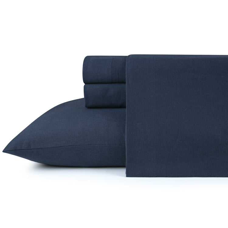 Navy blue bed sheets and pillowcase set on a white background