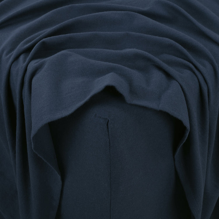 Close-up of dark blue fabric with folds