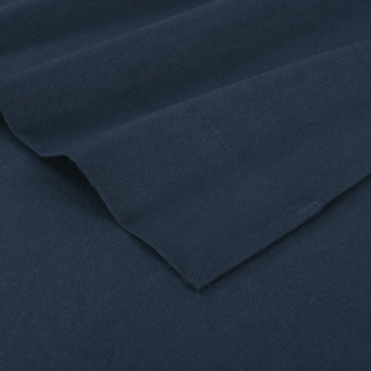 Close-up of dark blue fabric with a folded edge