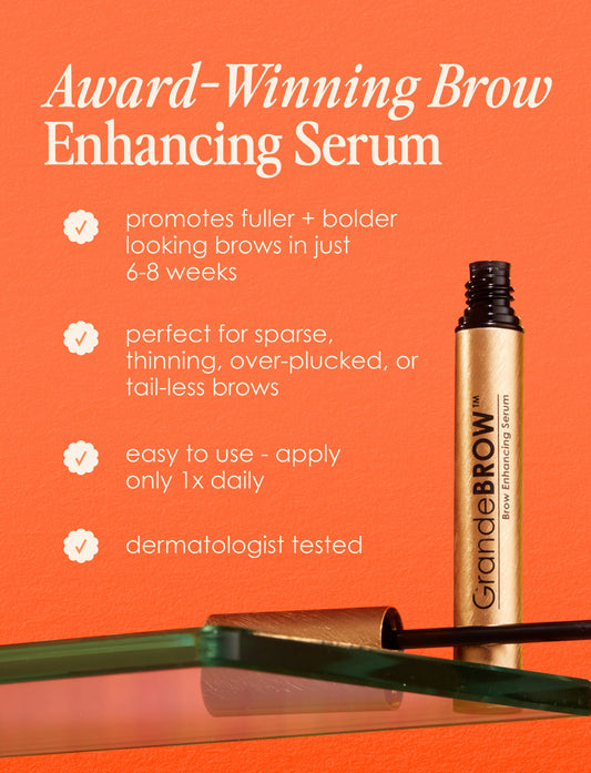 GrandeBrow brow enhancing serum with gold packaging and black applicator on a white background