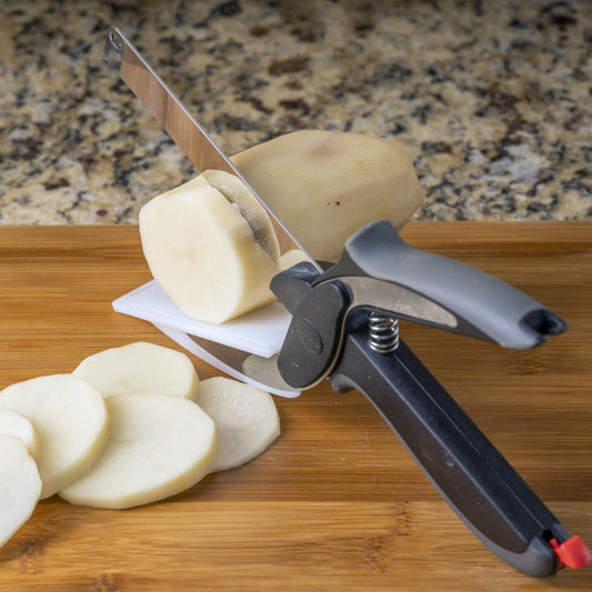 Set of kitchen tools including a peeler, mandoline, and other cutting tools with sliced vegetables on a white background.
