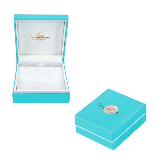 Silver earrings with intricate designs on a light blue gradient background