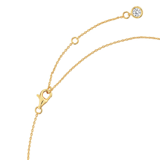 Gold necklace with a diamond pendant on a white background