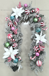 Decorative Christmas garland with colorful ornaments on a white background