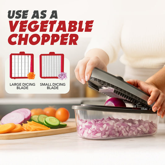 Chopping device with container filled with chopped onions on a marble surface with vegetables around.