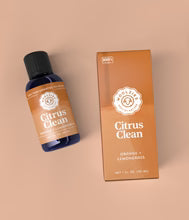 Bottle and box of 'Citrus Clean' on a beige background