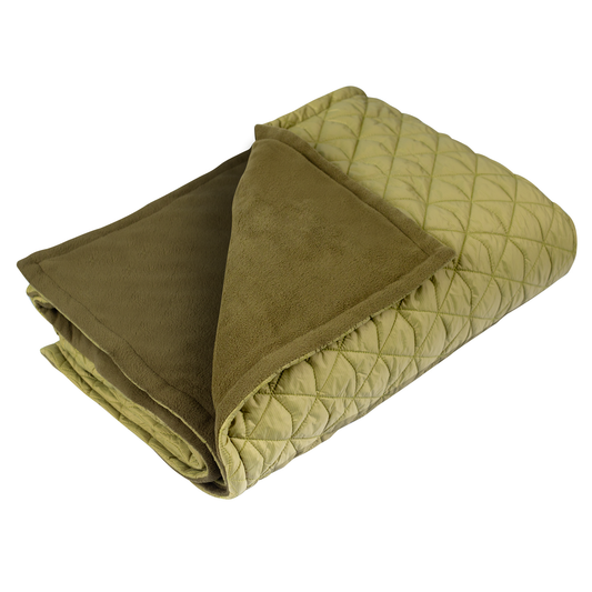 Folded green quilt with diamond pattern on a white background