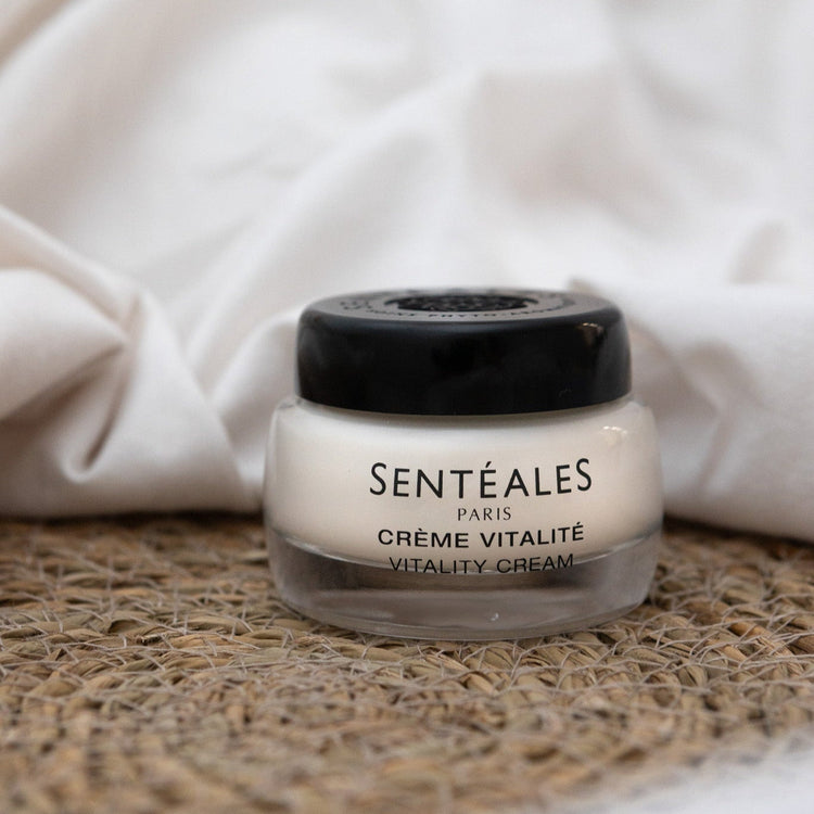 Jar of Sentéales Paris Crème Vitalité on a textured surface with a white fabric background