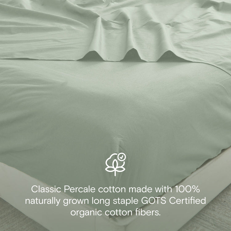 Green bed sheets with a GOTS certification logo on a neutral background