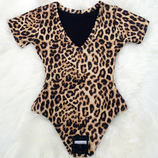 Leopard print bodysuit worn by a person on a white background