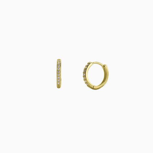 Gold hoop earrings with small diamonds on a white background