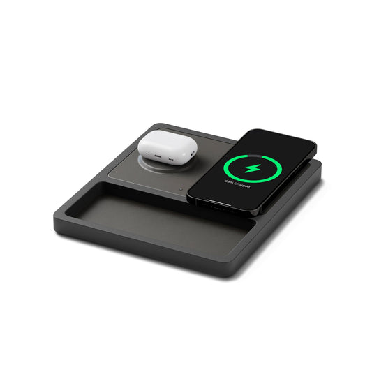 A wireless charging pad with two charging coils and separate charging ports for USB-C and USB-A, with an iPhone and AirPods on it indicating the MagSafe technology.