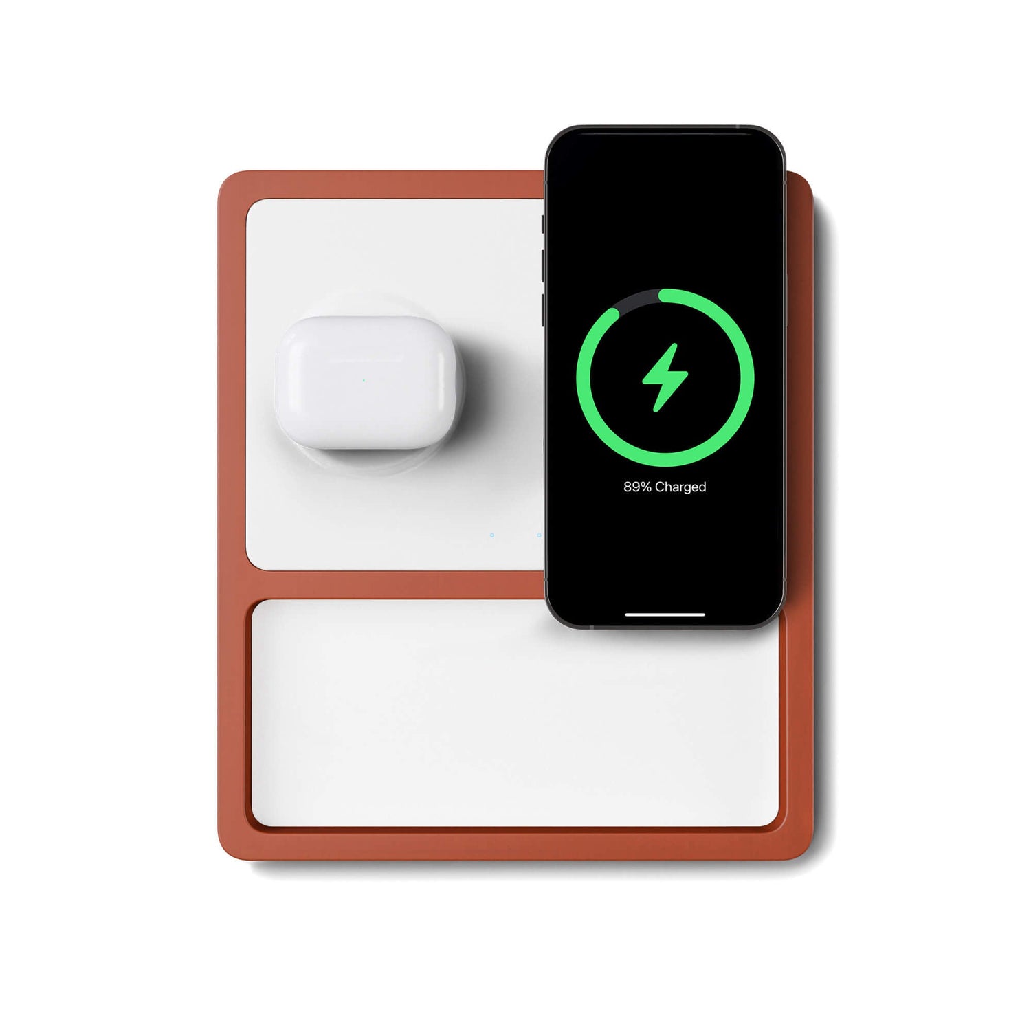 A wireless charging pad with a compartment for charging AirPods or small devices, and another for a smartphone, with a smartphone on top indicating charging status.