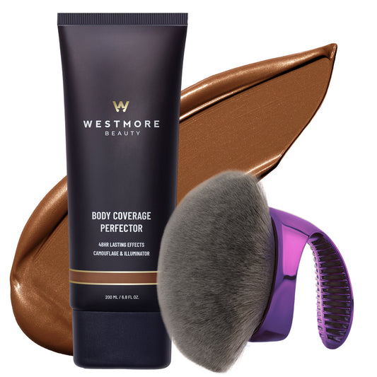 Westmore Beauty Body Coverage Perfector set featuring a dark navy blue squeeze tube, a large metallic bronze makeup swatch, a gray makeup brush, and a purple electric massager brush attachment, all on a clean white background.
