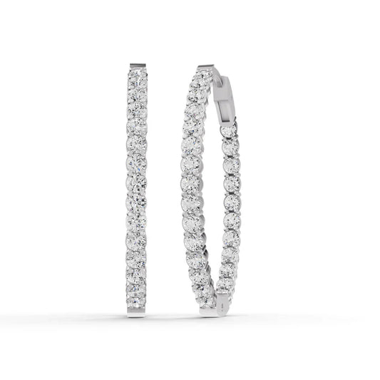 Pair of diamond hoop earrings on a white background
