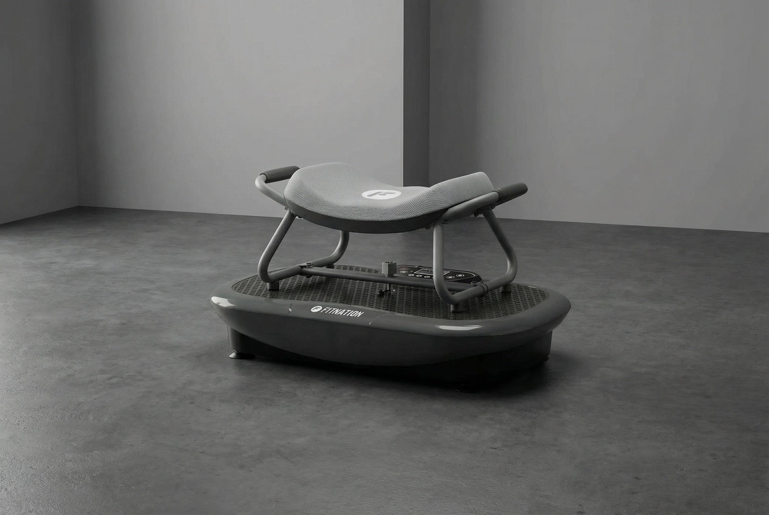 Gray vibration plate on a concrete floor with a plain background