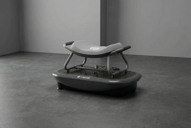 Gray vibration plate on a concrete floor with a plain background