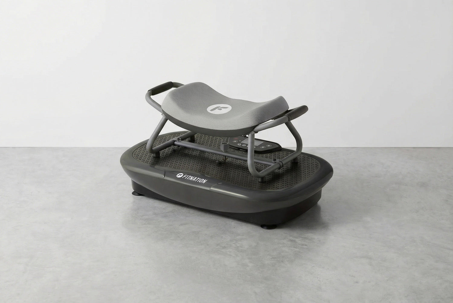Black vibration plate on a gray surface with a white background