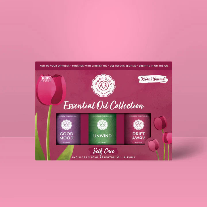 Essential oil collection packaging on a pink background