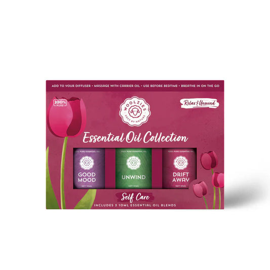 Wolz & Co Essential Oil Collection packaging with three bottles on a pink background