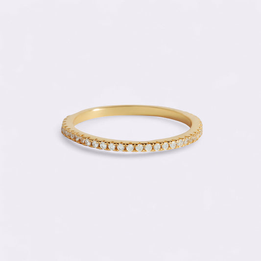 Gold ring with small diamonds on a white background