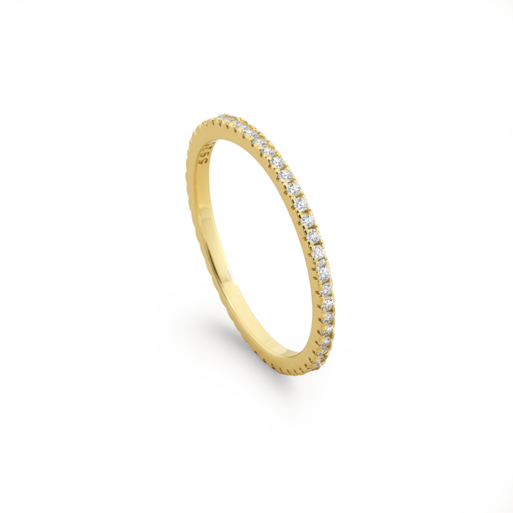 Gold ring with small diamonds on a white background