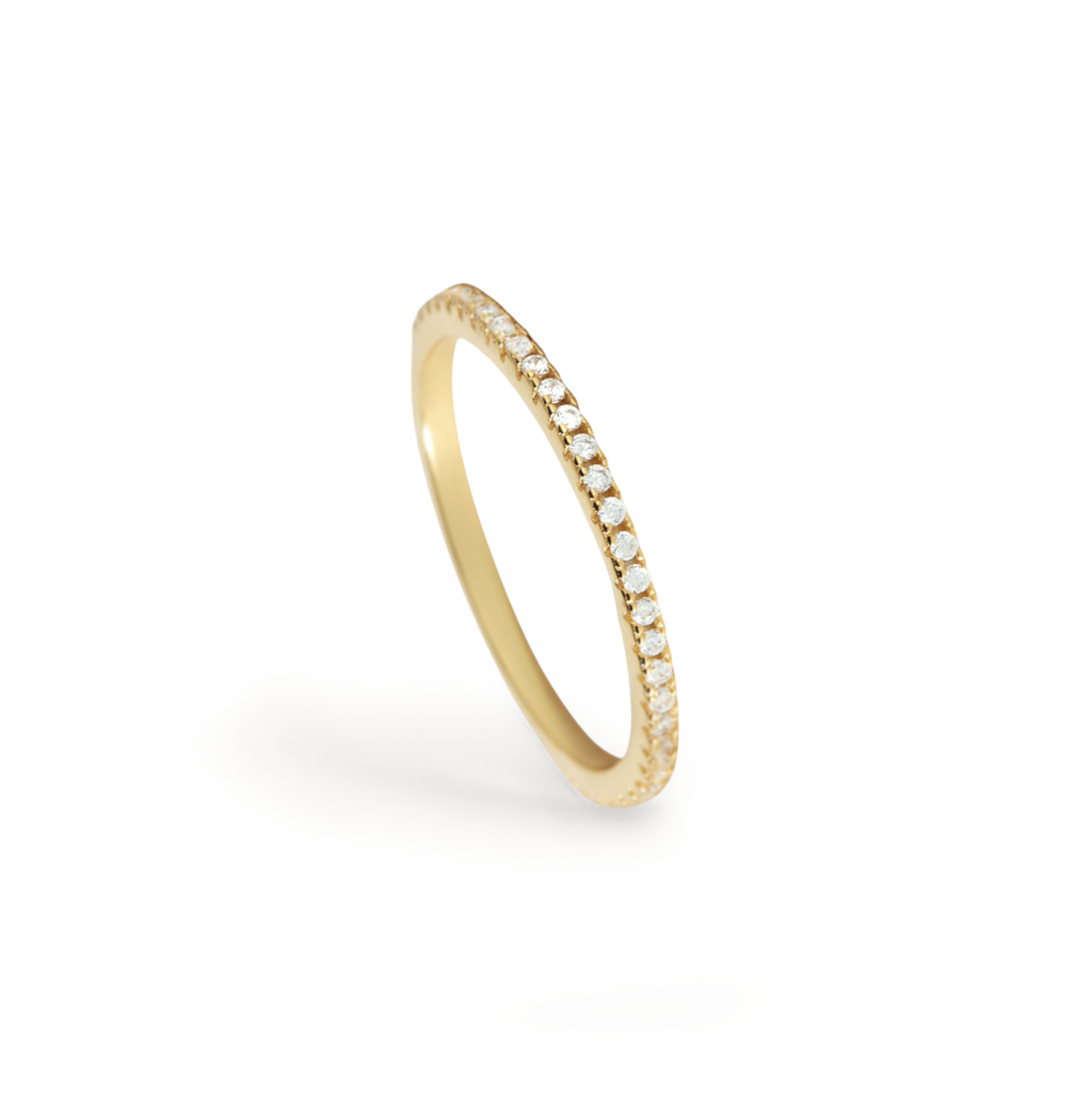 Gold ring with small diamonds on a white background