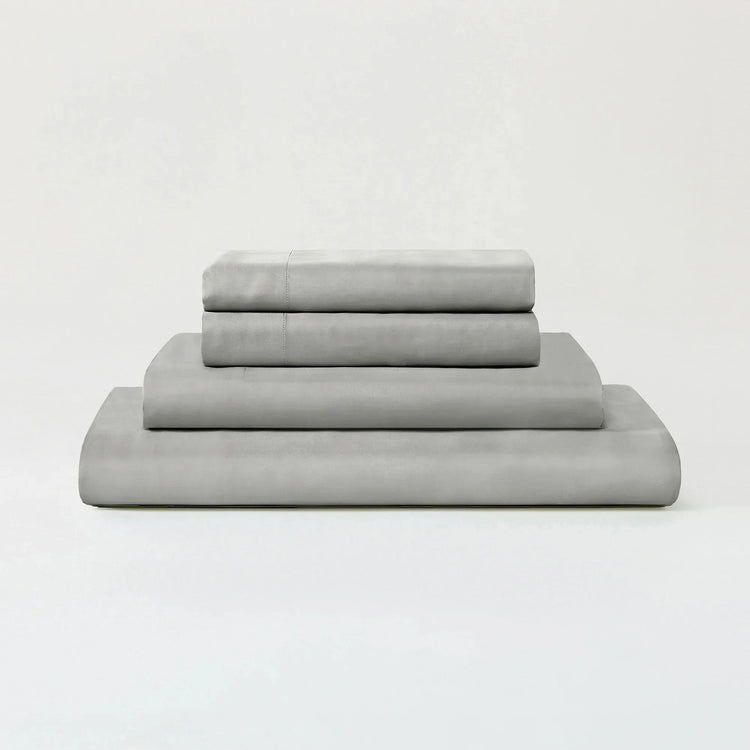 Stack of gray folded towels on a white background