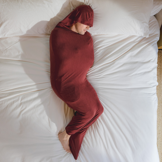 Turquoise#man in Sleep Pod Hood in bed laying down