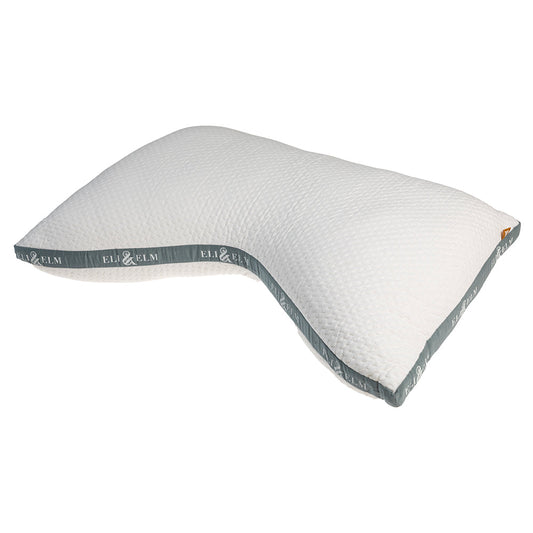 A white, rectangular side sleeper pillow with a pillowcase on a bed, against a wooden headboard background.