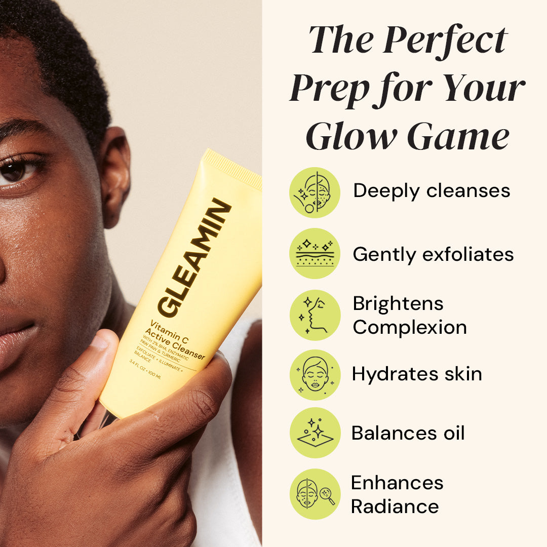 Person holding a yellow skincare product with text about its benefits on a beige background