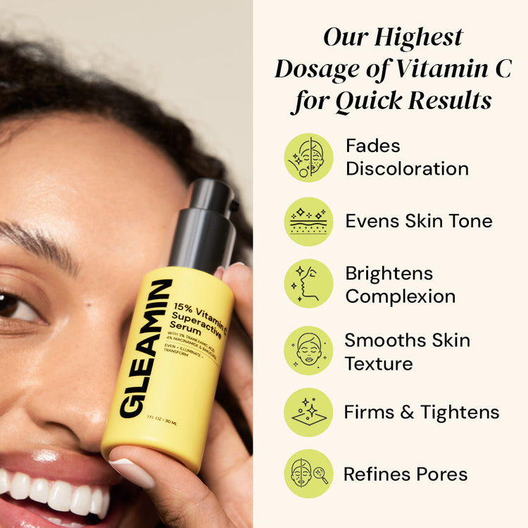 Person holding a yellow serum bottle with text about vitamin C serum benefits.