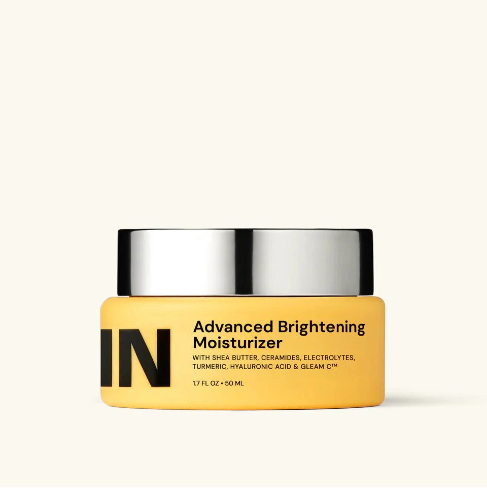 Yellow jar of Advanced Brightening Moisturizer with silver lid on a white background