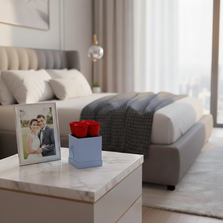 Modern bedroom with a bed, nightstand, and decorative items.