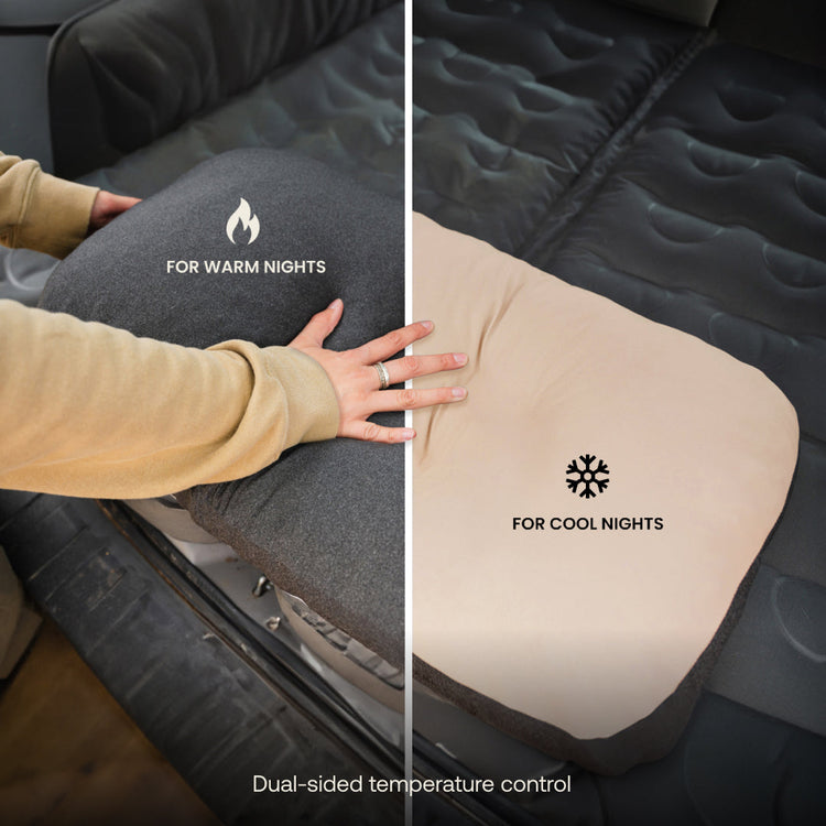 A person flips a Luno® Packable Camping Pillow with a dark "For Warm Nights" side and a light "For Cool Nights" side on a car seat, highlighting its temperature control feature.