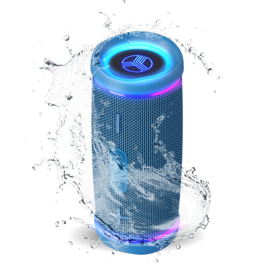 Blue portable speaker with LED lights surrounded by water droplets on a white background