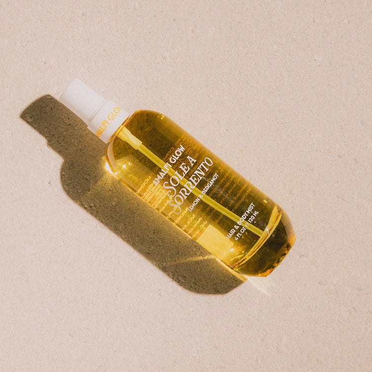 Yellow bottle with white cap on a beige background