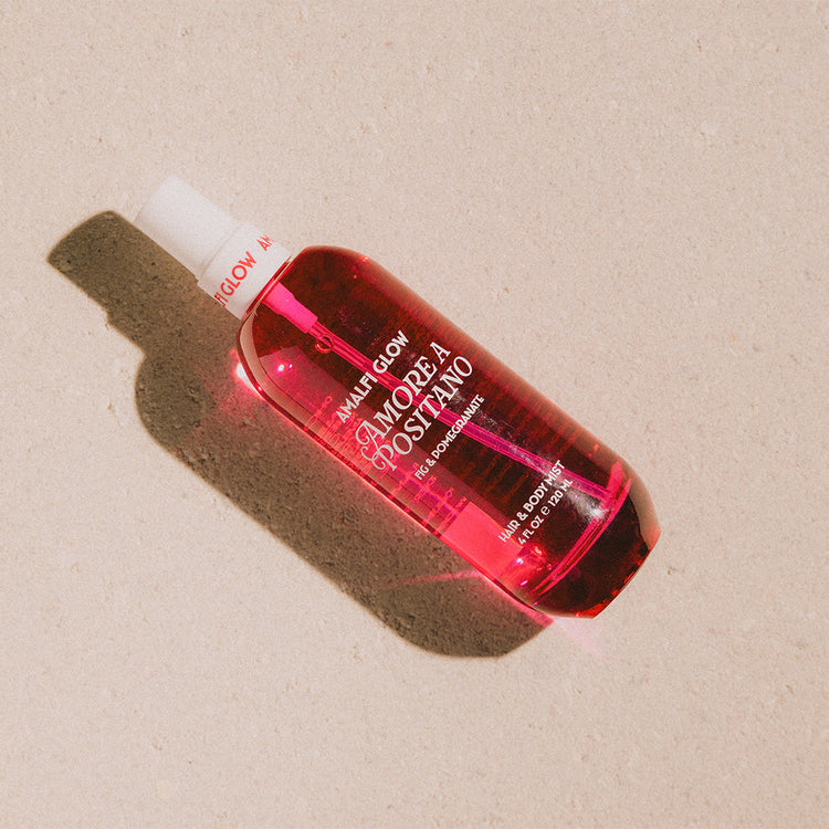 Red bottle with a label on a beige background