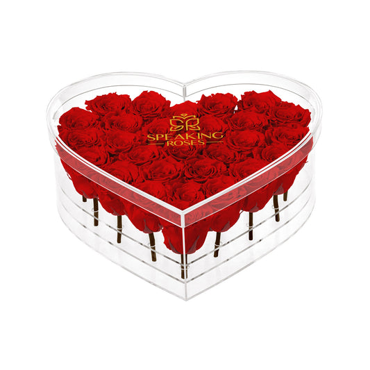 Heart-shaped box of red roses with 'Speaking Roses' logo on a white background